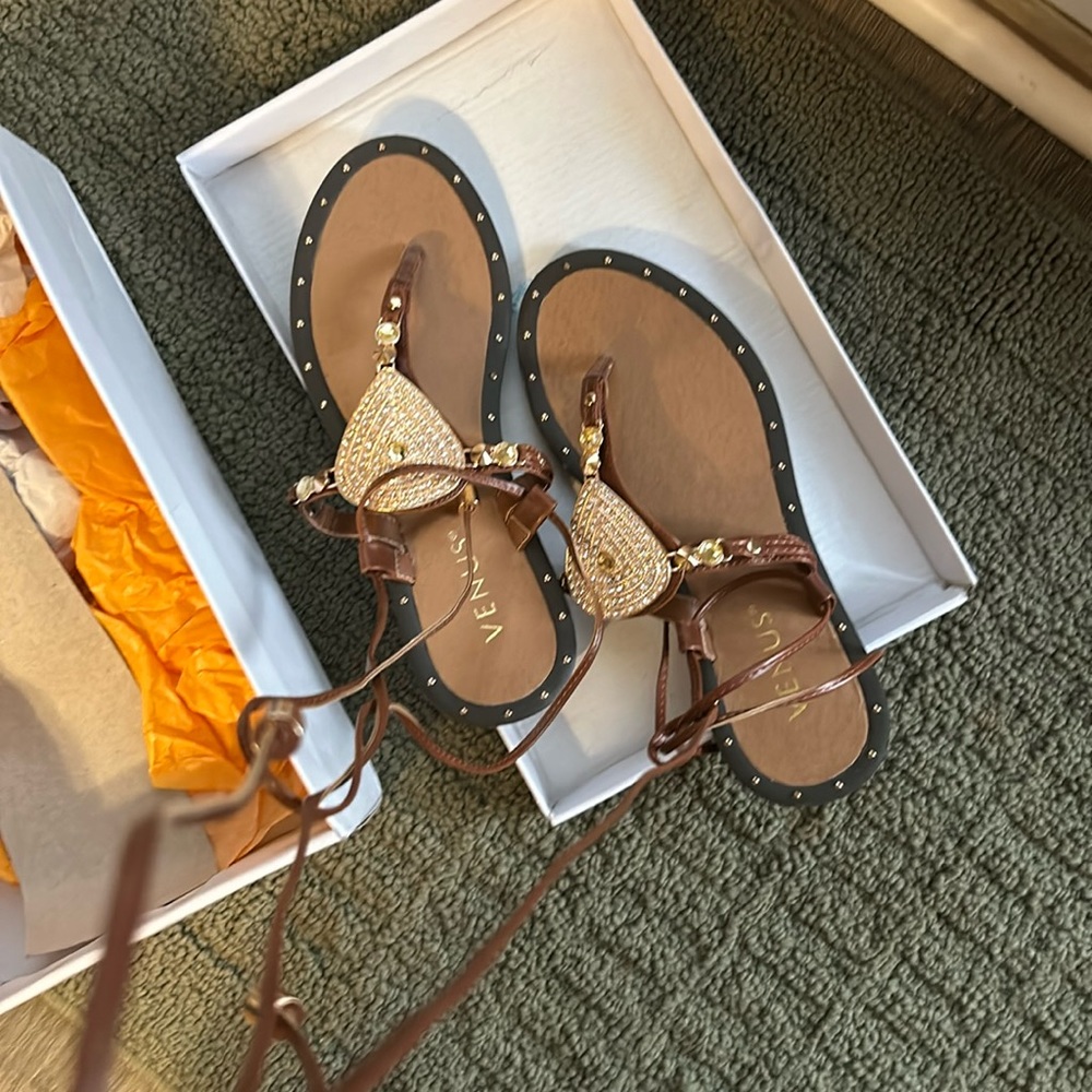 Size 6.5 gladiator flip flops new in box never worn